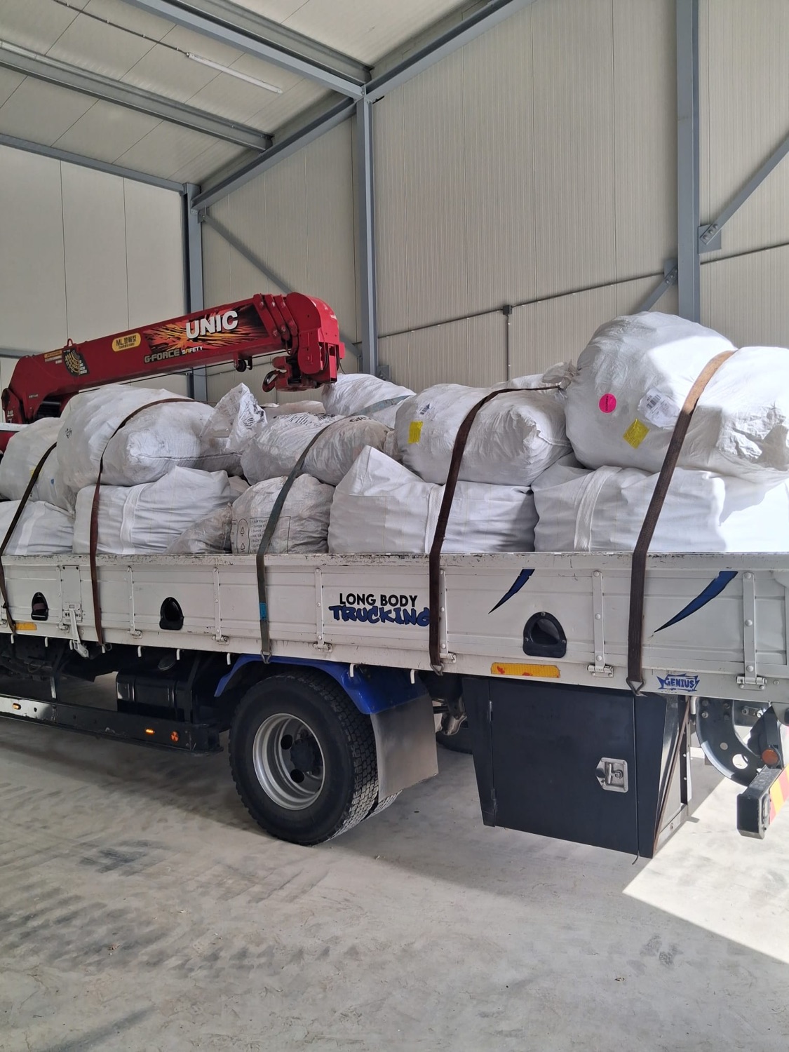 Truck full of big bags in the warehouse